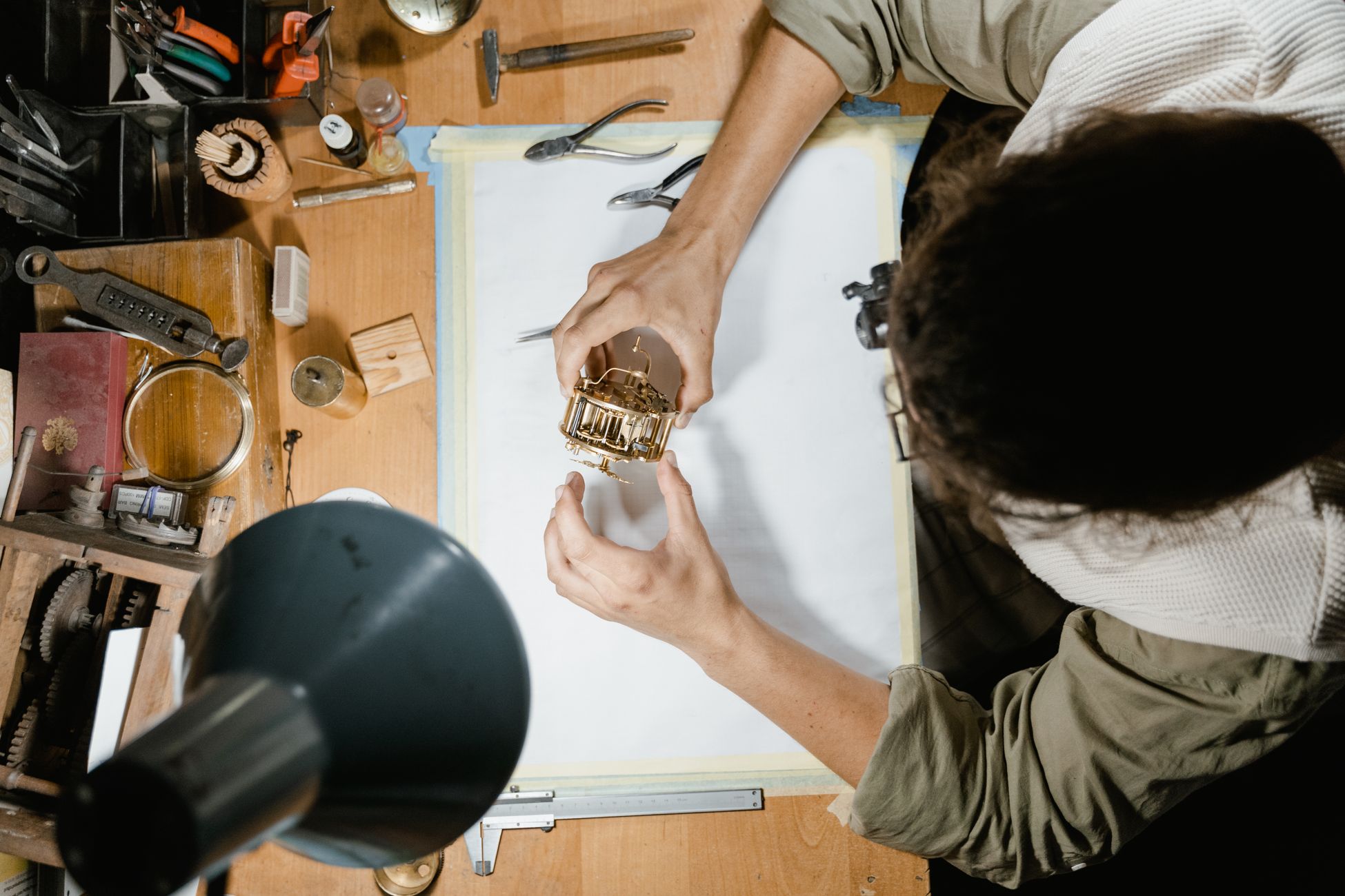 Restoring an antique clock movement by hand at Hills Antique Clocks